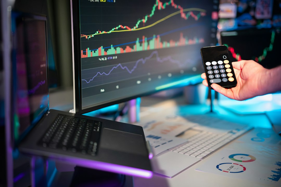 Semiconductor chips beside a stock chart on laptop