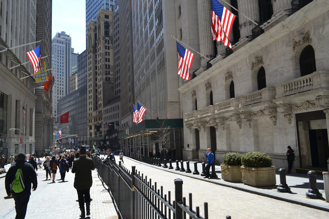 New York Stock Exchange facade and Wall Street sign