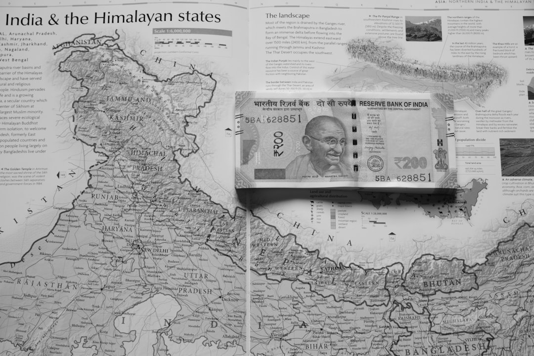 Indian rupee banknotes beside legal case files