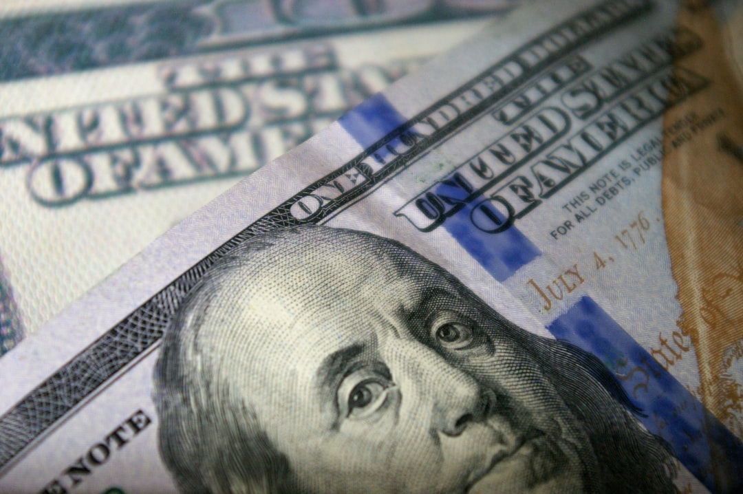 US inflation report displayed beside dollar bills